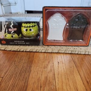 Two Halloween salt and pepper shakers